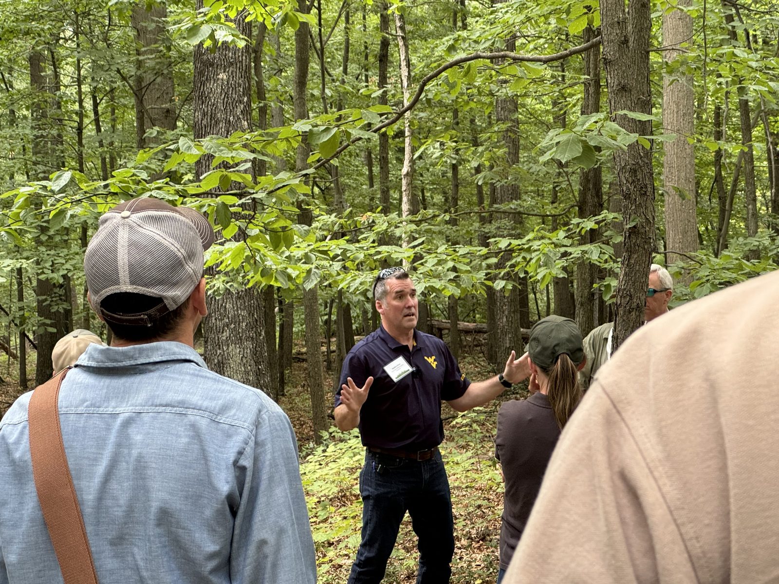 Instructor teaching in a wooded stand